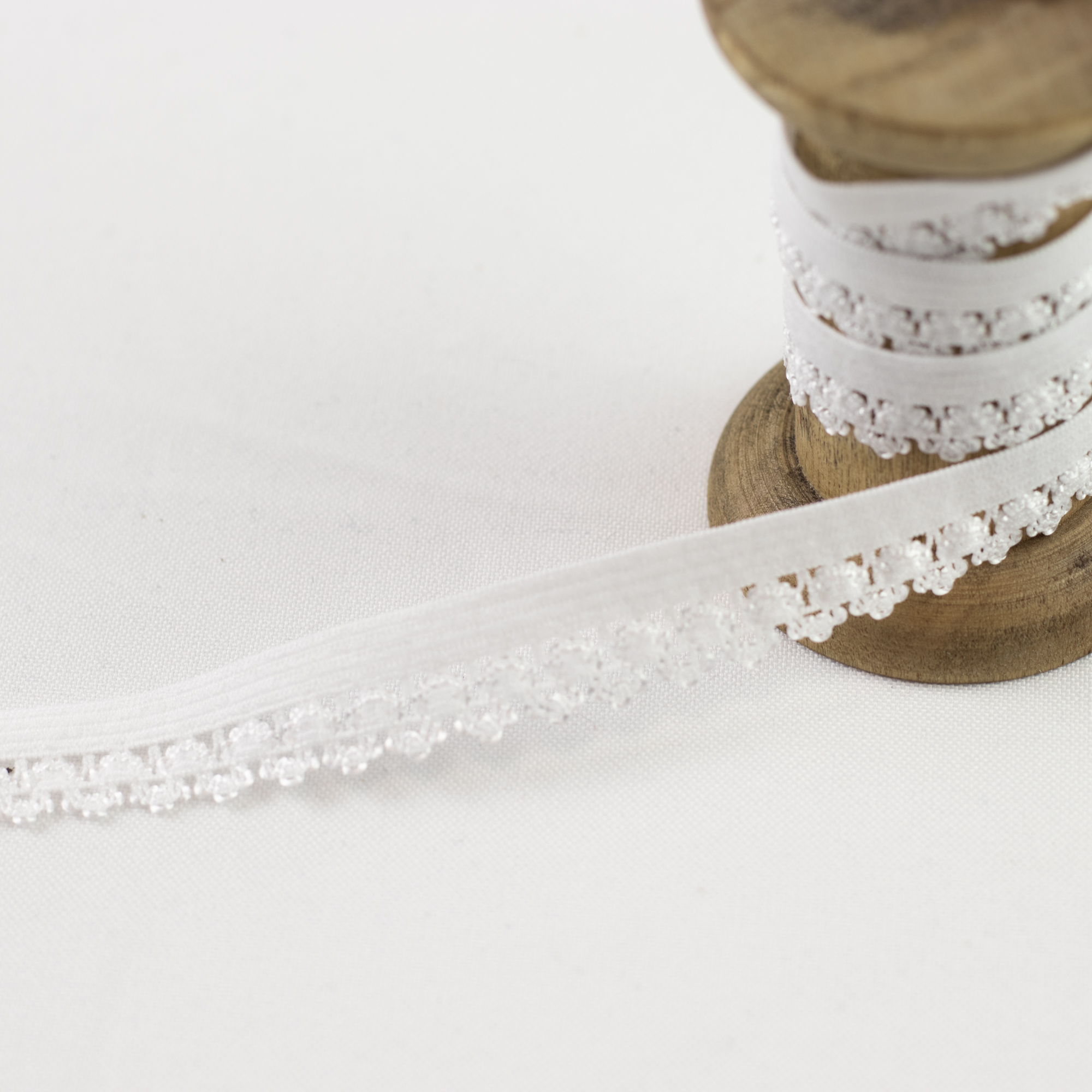 Gummiband Wäschegummi Zierband Uni mit Spitze 1 cm Weiß